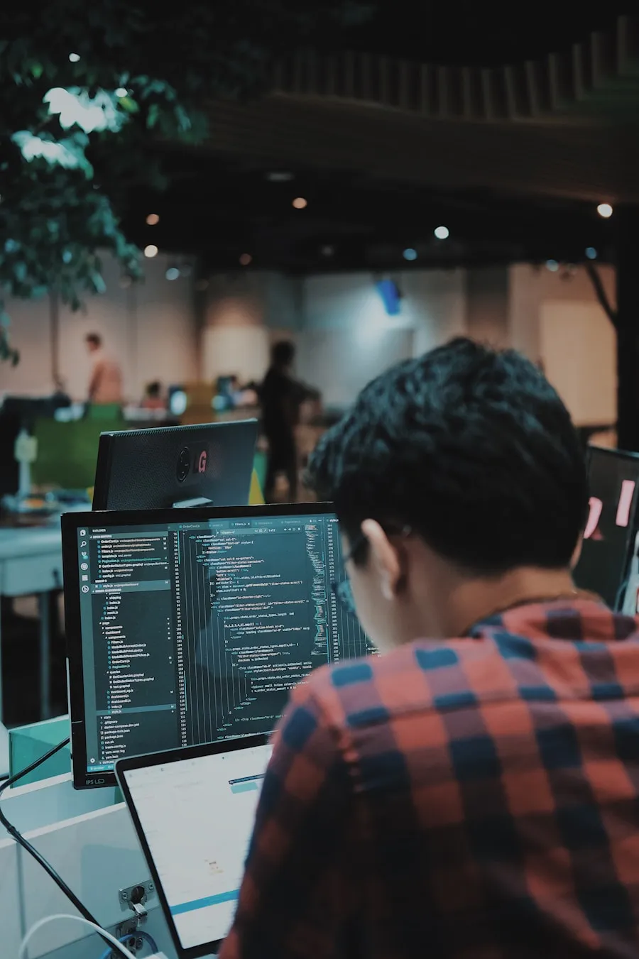 Developer coding with dark theme interface